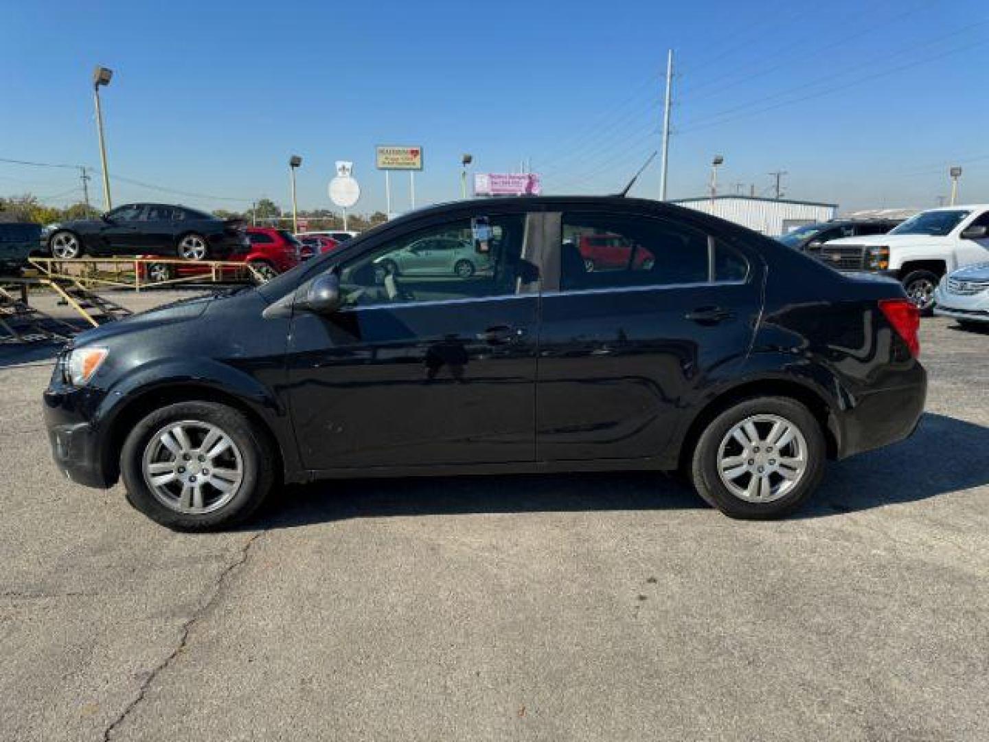 2013 BLACK Chevrolet Sonic LT Auto Sedan (1G1JC5SB1D4) with an 1.4L L4 DOHC 24V TUR engine, 6-Speed Automatic transmission, located at 2715 W Pioneer Pkwy, Arlington, TX, 76013, (817) 265-9009, 32.710262, -97.153236 - Photo#2