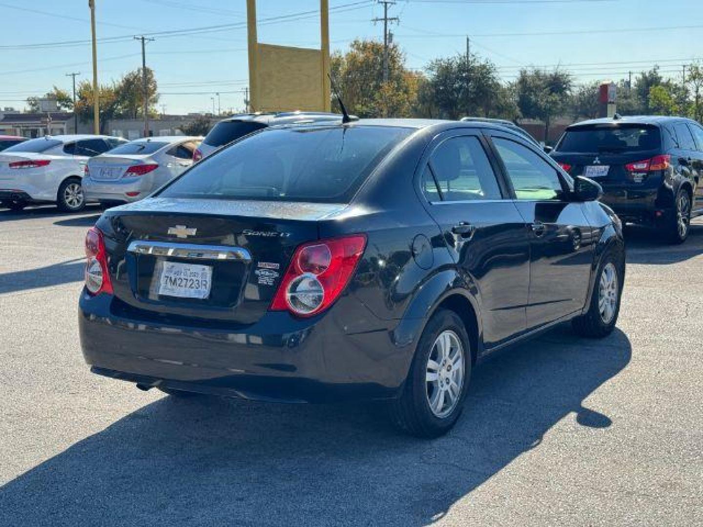 2013 BLACK Chevrolet Sonic LT Auto Sedan (1G1JC5SB1D4) with an 1.4L L4 DOHC 24V TUR engine, 6-Speed Automatic transmission, located at 2715 W Pioneer Pkwy, Arlington, TX, 76013, (817) 265-9009, 32.710262, -97.153236 - Photo#7