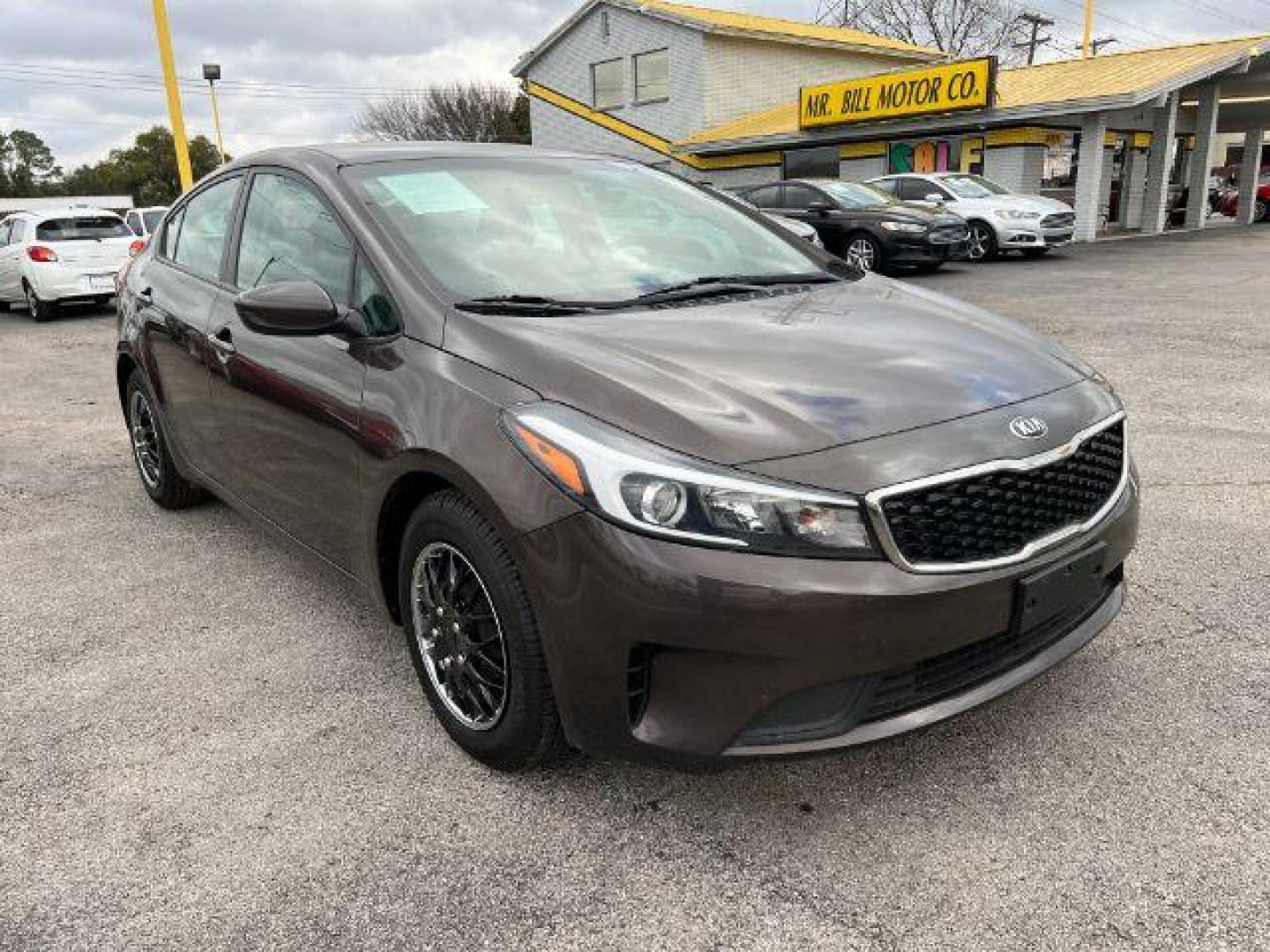 2017 BROWN Kia Forte LX 6A (3KPFK4A77HE) with an 2.0L L4 DOHC 16V engine, 6-Speed Automatic transmission, located at 2715 W Pioneer Pkwy, Arlington, TX, 76013, (817) 265-9009, 32.710262, -97.153236 - Photo#4