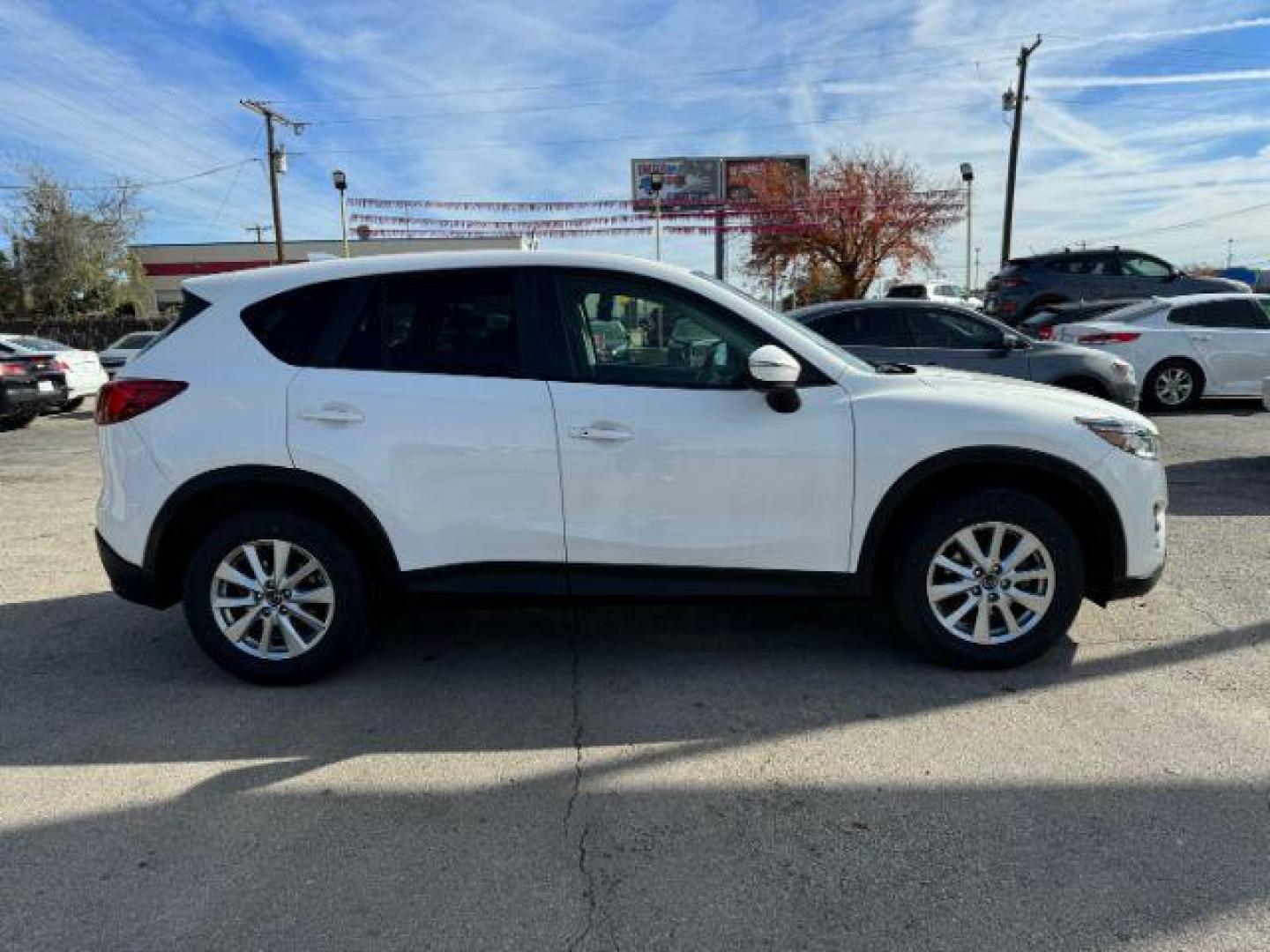 2016 White Mazda CX-5 Touring (JM3KE2CY5G0) with an 2.5L L4 DOHC 16V engine, 6-Speed Automatic transmission, located at 2715 W Pioneer Pkwy, Arlington, TX, 76013, (817) 265-9009, 32.710262, -97.153236 - Photo#5