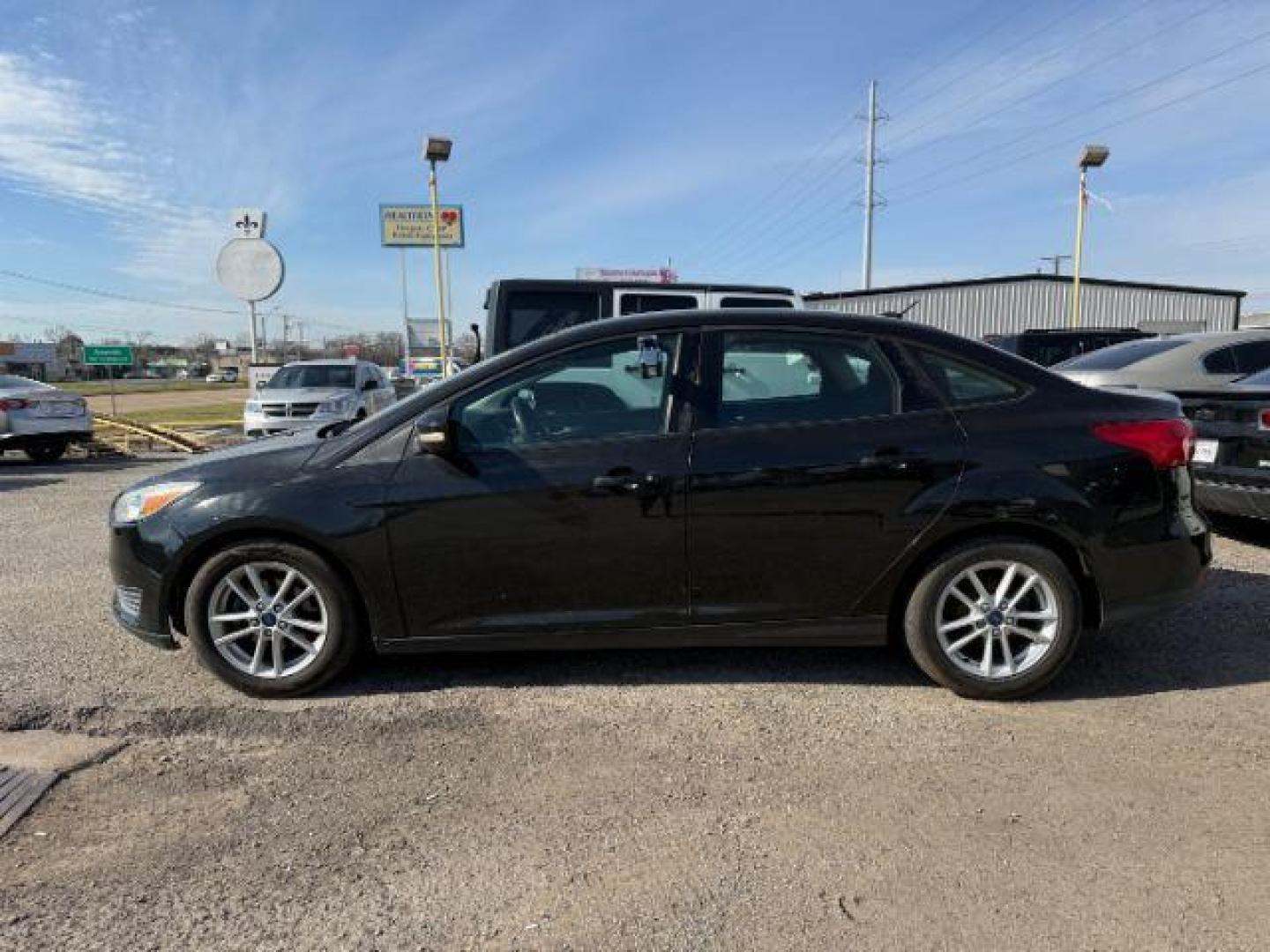 2015 BLACK Ford Focus SE Sedan (1FADP3F20FL) with an 2.0L L4 DOHC 16V engine, located at 2715 W Pioneer Pkwy, Arlington, TX, 76013, (817) 265-9009, 32.710262, -97.153236 - Photo#2