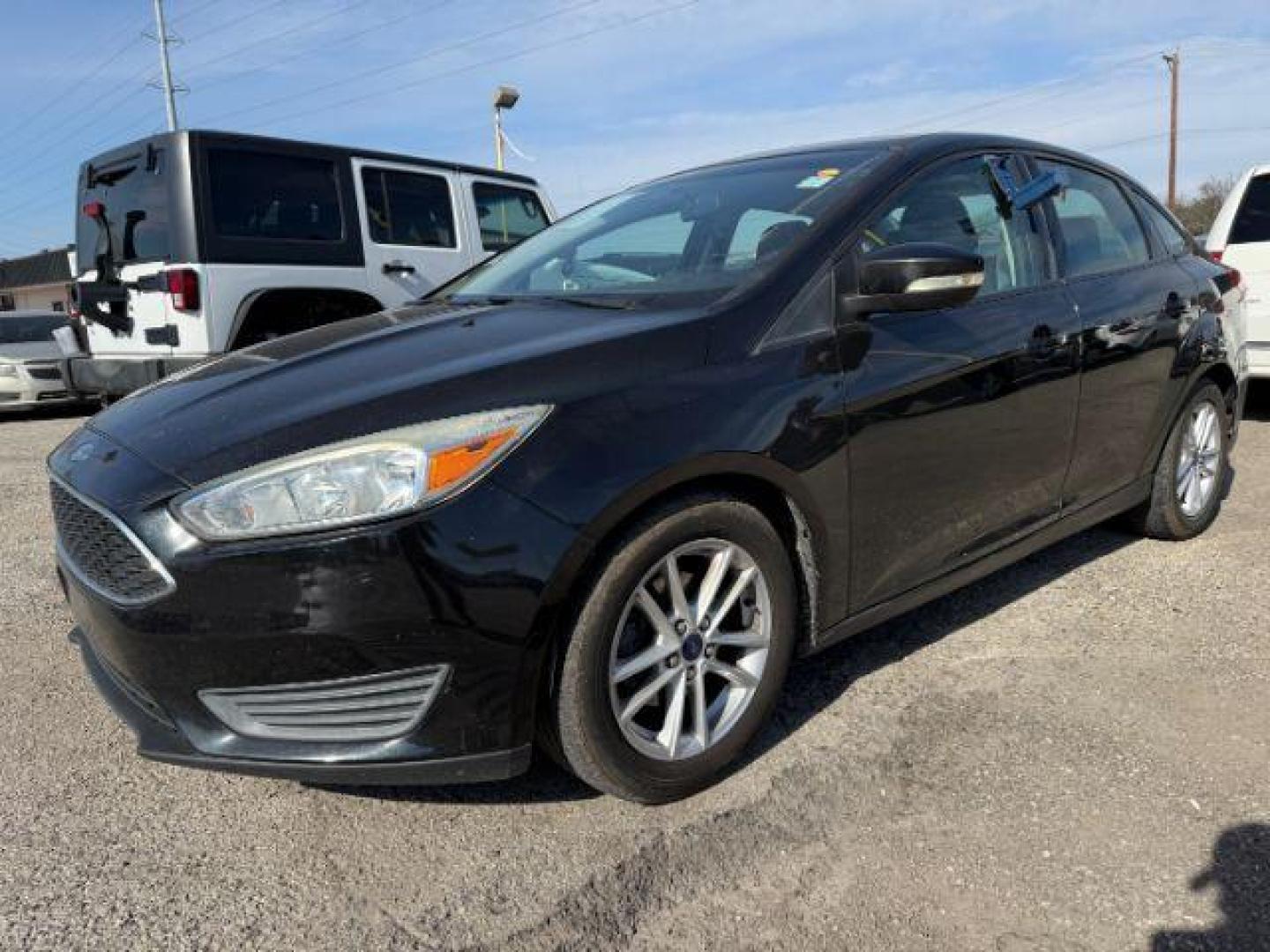 2015 BLACK Ford Focus SE Sedan (1FADP3F20FL) with an 2.0L L4 DOHC 16V engine, located at 2715 W Pioneer Pkwy, Arlington, TX, 76013, (817) 265-9009, 32.710262, -97.153236 - Photo#3