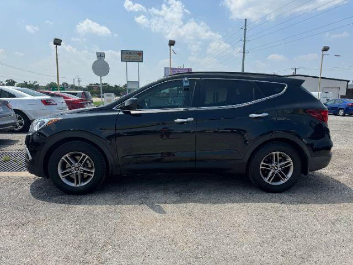 2017 BLACK Hyundai Santa Fe Sport 2.4 FWD (5XYZU3LB7HG) with an 2.4L L4 DOHC 16V engine, 6-Speed Automatic transmission, located at 2715 W Pioneer Pkwy, Arlington, TX, 76013, (817) 265-9009, 32.710262, -97.153236 - Photo#2