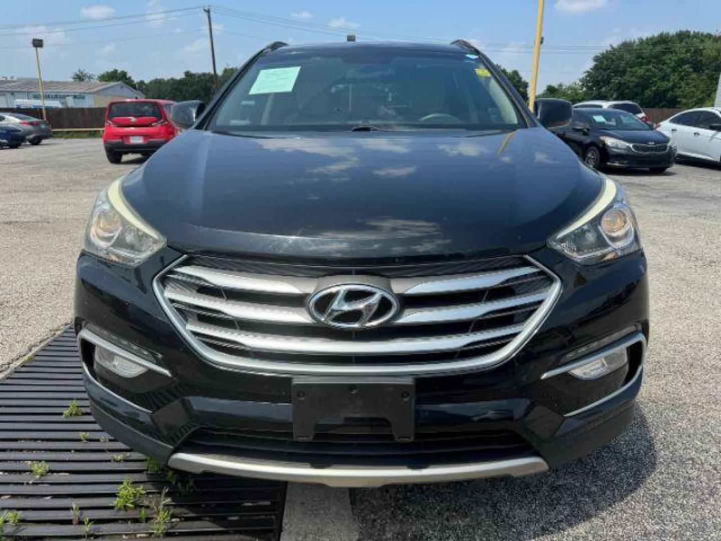 2017 BLACK Hyundai Santa Fe Sport 2.4 FWD (5XYZU3LB7HG) with an 2.4L L4 DOHC 16V engine, 6-Speed Automatic transmission, located at 2715 W Pioneer Pkwy, Arlington, TX, 76013, (817) 265-9009, 32.710262, -97.153236 - Photo#4