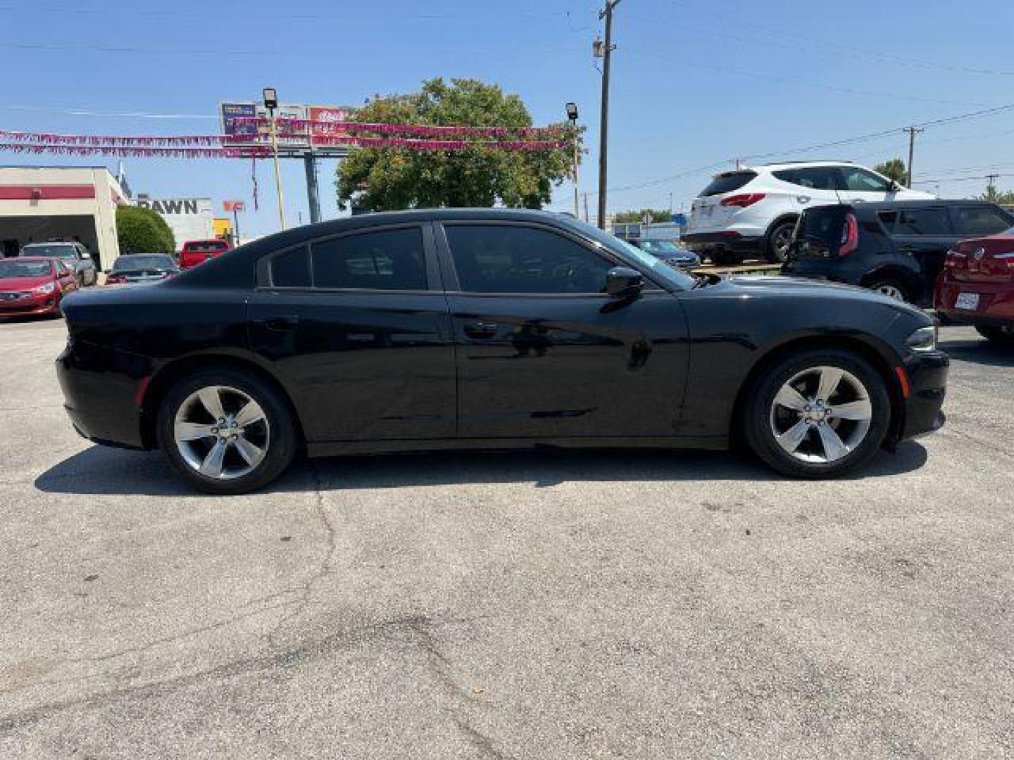 2015 BLACK Dodge Charger SXT (2C3CDXHG5FH) with an 3.6L V6 DOHC 24V engine, 8-Speed Automatic transmission, located at 2715 W Pioneer Pkwy, Arlington, TX, 76013, (817) 265-9009, 32.710262, -97.153236 - Photo#5