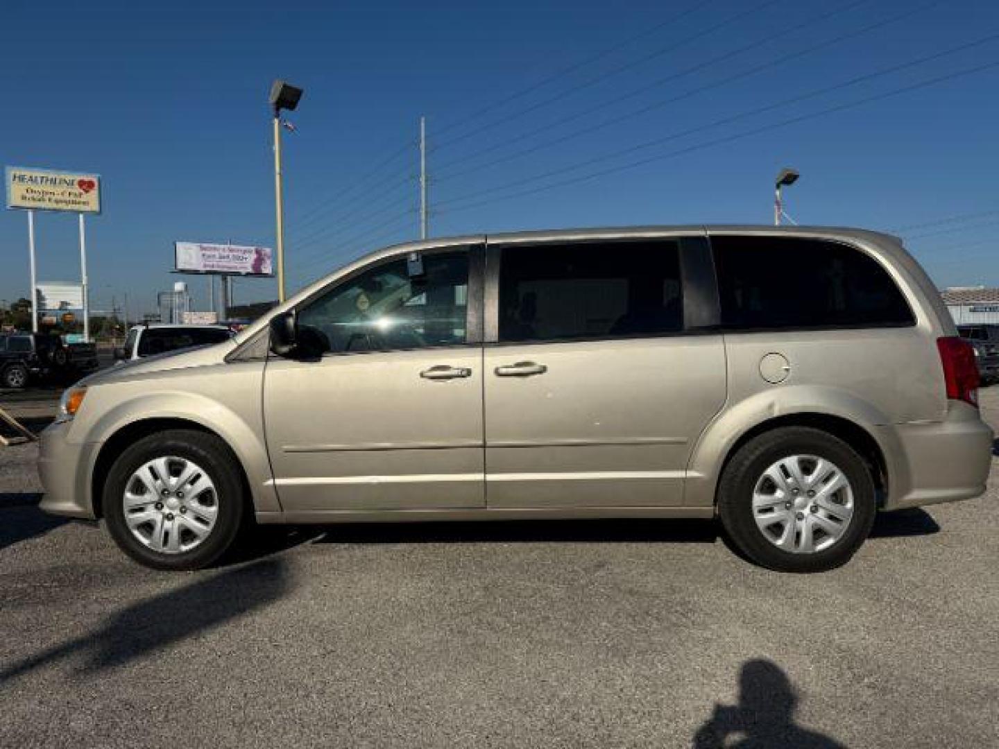 2014 TAN Dodge Grand Caravan SE (2C4RDGBGXER) with an 3.6L V6 DOHC 24V engine, 6-Speed Automatic transmission, located at 2715 W Pioneer Pkwy, Arlington, TX, 76013, (817) 265-9009, 32.710262, -97.153236 - Photo#1